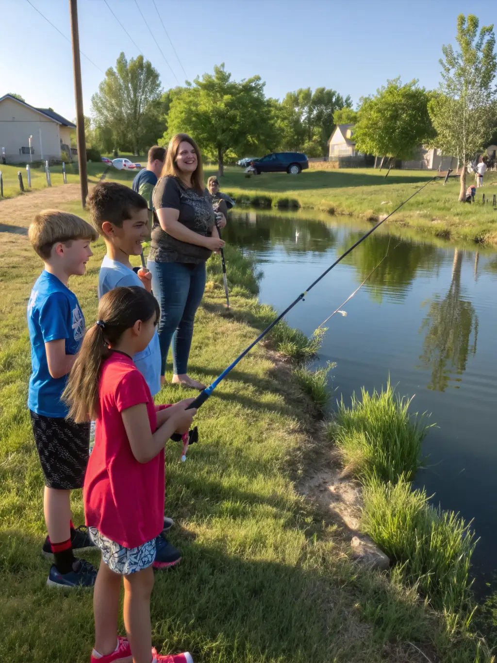 A group of children participating in a fishing workshop, learning about responsible angling techniques and the importance of conservation.